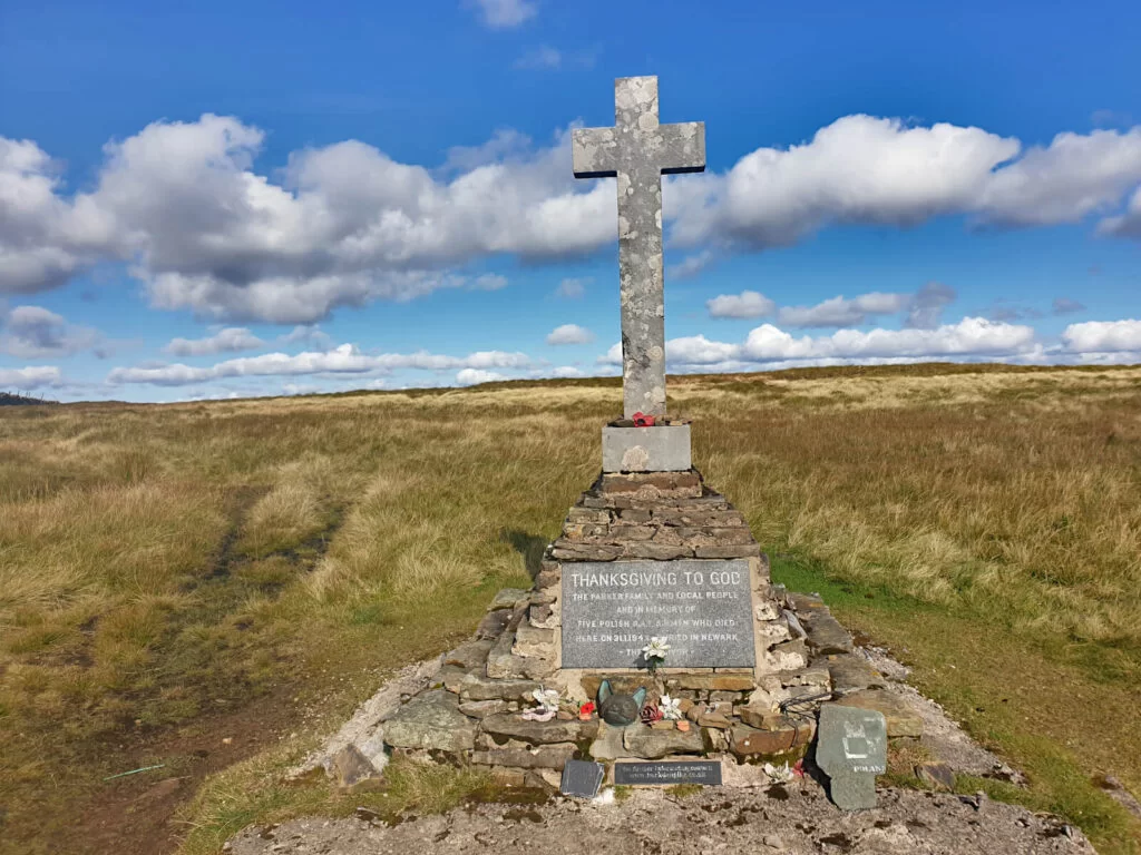 Stone cross on a loose brick memorial to the 5 Polish soldiers who died in a plane crash here in 1942. A poignant moment on this Buckden Pike Walk