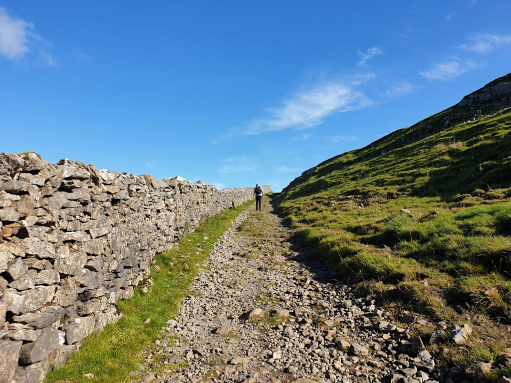 This Buckden Pike Walk starts steeply and carries on like this for quite a while! Picture shows a gravel like path climbing steeply toward the sky