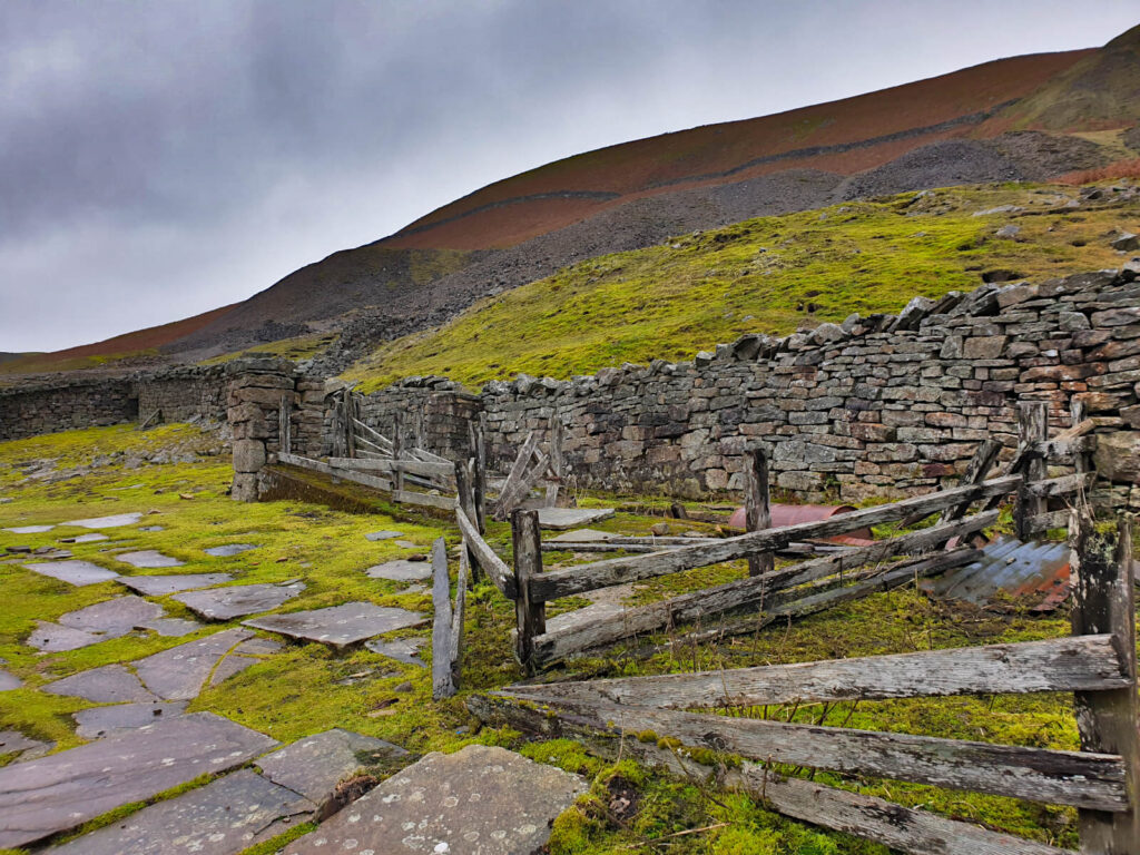 Behind the remains of Crackpot hall are large mounds of slate and rock from its mining days.