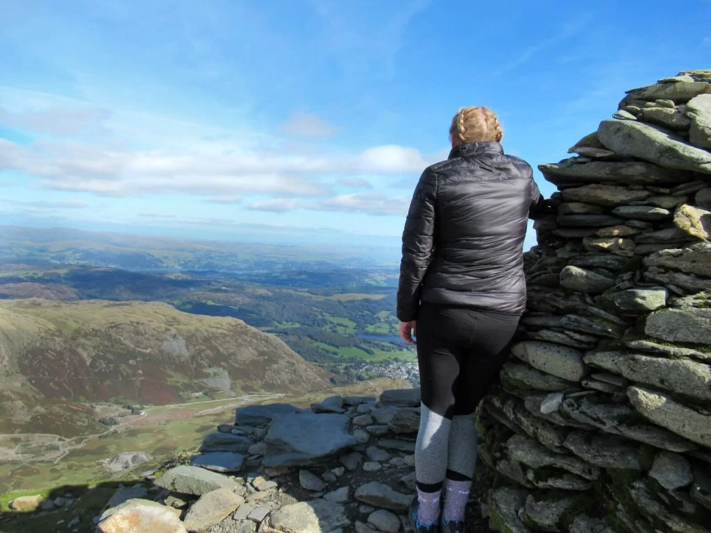 Zoe looking out from the summit of Coniston Old Man