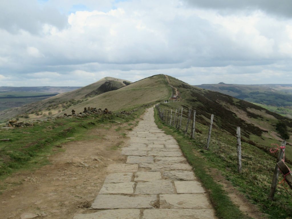 Looking east along the Great Ridge. The stone path runs along the centre of the image as the hills descend on both sides. A fantastic section of the Mam Tor walk