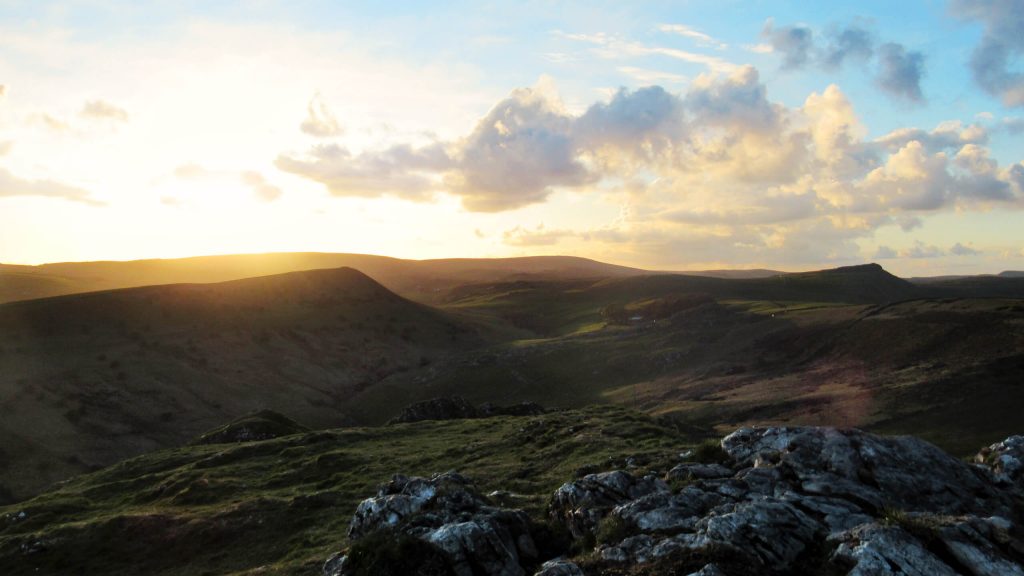 These stunning sunset views of a golden sky against the dark hills of the Peak District are one of the reasons that climbing Chrome Hill is one of the best walks in the area!