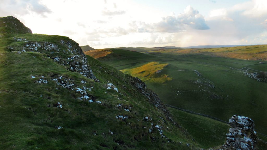 Chrome Hill has some of the best sunrise or sunset views in the Peak District. This rocky peak, nicknamed Dragon's Back, stands out against the gentle hills of the Derbyshire countryside.