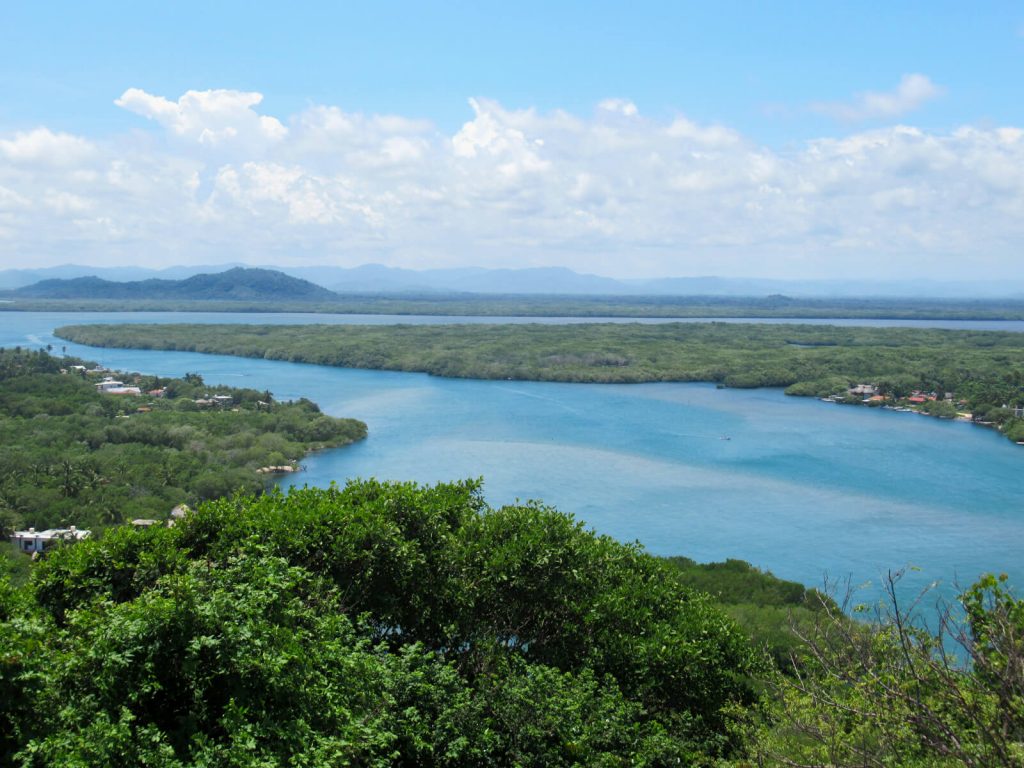 Looking inland over the lagoon estuary and lagoon, with the Oaxaca mountains in the background