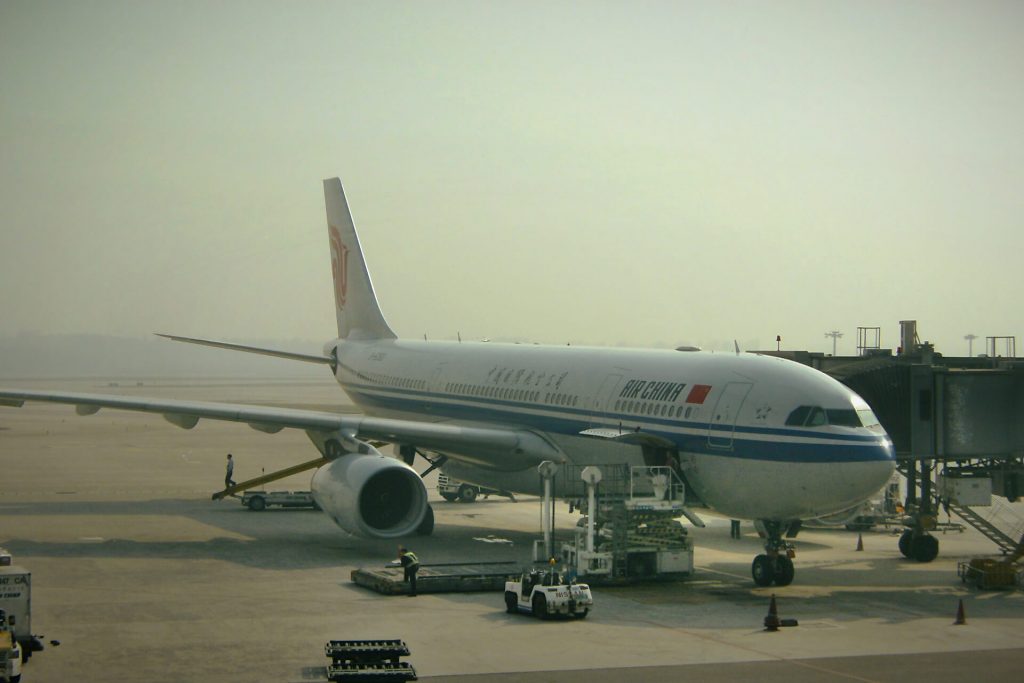 Air China plane loading at the gate at Beijing International Airport