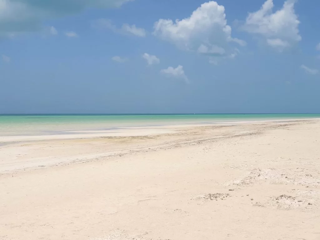 Paradise! The beach eases gently into the calm sea in the distance