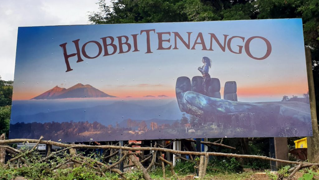 Welcome to Hobbitenango! The image shows a large painting placed at the park's entrance