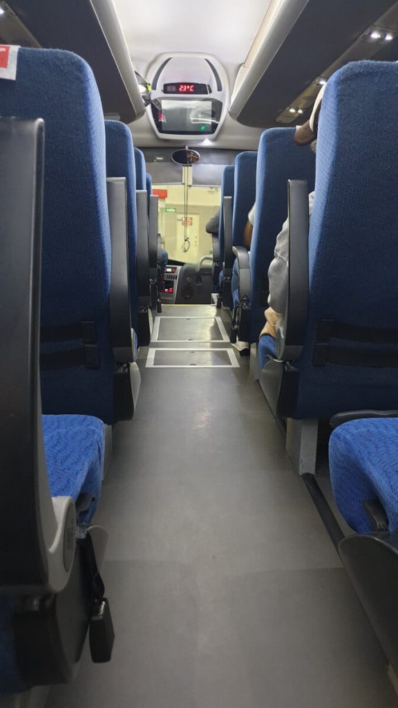 Looking down the aisle on an OCC bus, the same which is used on the journey from Oaxaca to Puerto Escondido