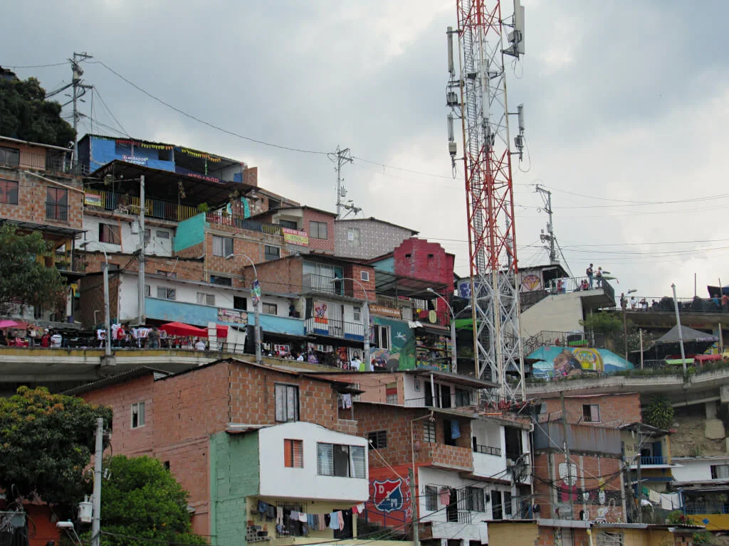 The main viaduct road through Comuna 13 with the houses and buildings climbing up the hillside